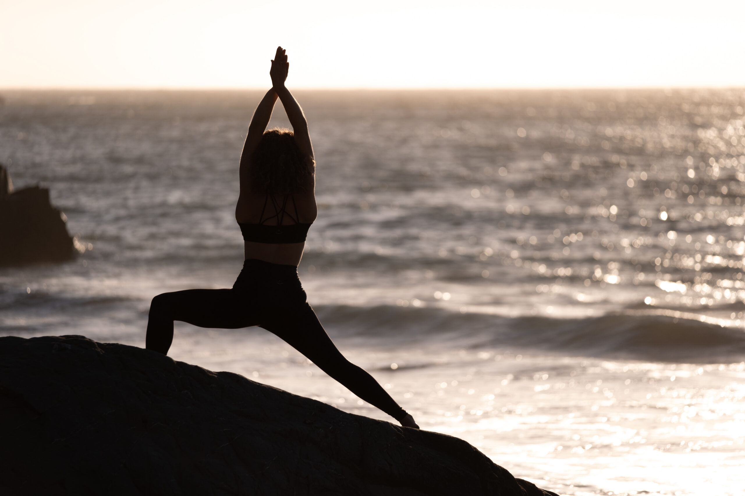 Silhouette of a person meditating in a yoga pose on Craiyon